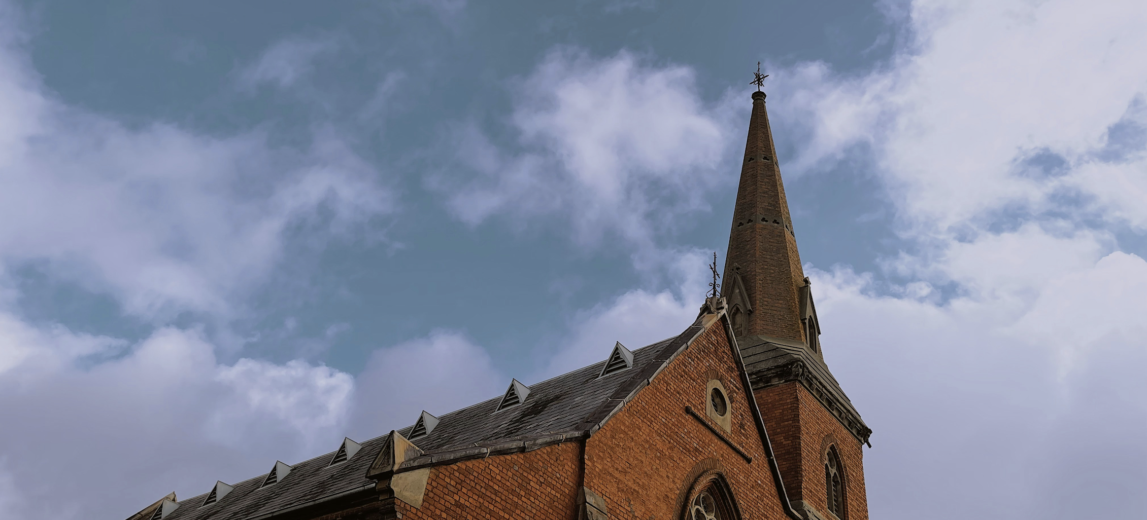 Church architecture with steeple and cross